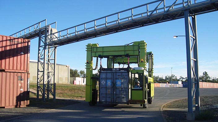 Isoloader Straddle Carriers with telescoping masts for low height clearances