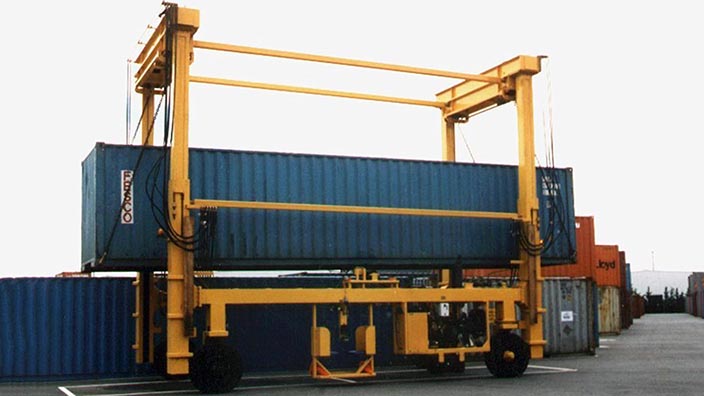 Isoloader Econolifter Straddle Carriers with telescoping masts for low height clearances and 2-high container stacking