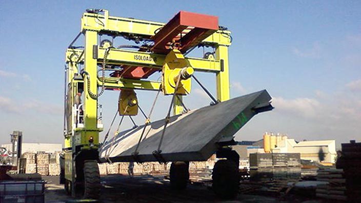 Isoloader Straddle Carriers and Rubber Tyred Gantries (RTGs) can manipulate as well as lift and transport heavy loads, including turning precast concrete segments upside down.